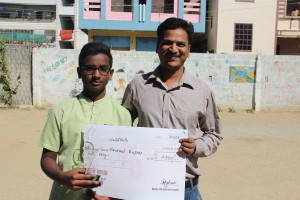 Nachiketh with his first prize and Science teacher Venkatesh